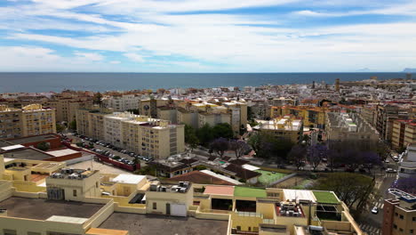 Cityscape-of-Estepona-and-seascape-horizon,-aerial-panoramic-view