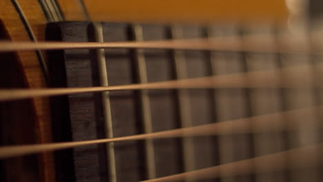 Extreme-closeup-on-acoustic-guitar-fretboard-and-soundhole