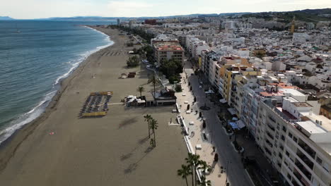 Exotic-resort-city-of-Estepona-with-coastal-buildings-and-huge-beach,-aerial-view