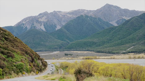 Vehicles-driving-along-the-state-highway-through-Arthurs-Pass,-New-Zealand