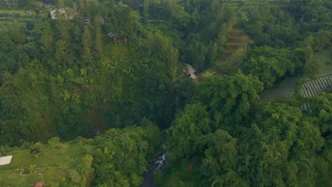 Aerial-view-of-waterfall-in-the-middle-of-the-forest