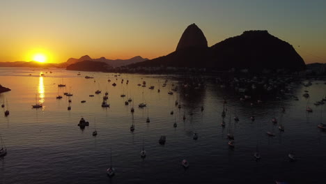 The-sun-rises-over-the-Botafogo-Cove-and-Sugar-Loaf-mountain-during-dawn-in-Rio-de-Janeiro-city,-Brazil
