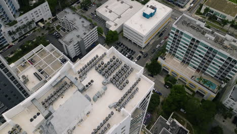 Aerial-view-tilting-over-buildings-in-Edgewater,-Miami,-cloudy-Florida,-USA