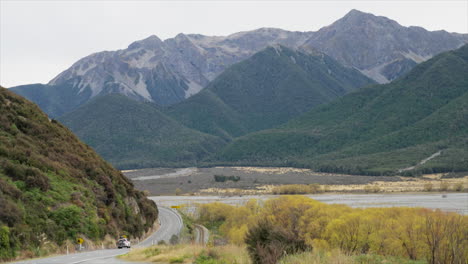 Black-4WD-driving-along-the-state-highway-through-Arthurs-Pass,-New-Zealand