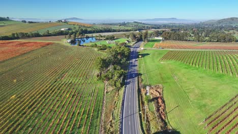 Aerial-of-traffic-on-the-Melba-Highway-in-the-Yarra-Valley-near-Yarra-Glen-with-morning-fog-beyond