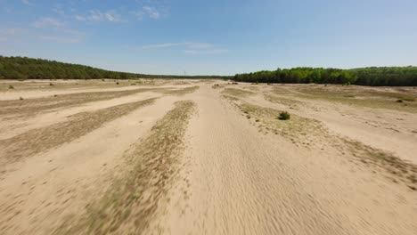 Sandy-desert-of-Pustynia-Bledowska-in-Poland,-aerial-FPV-view