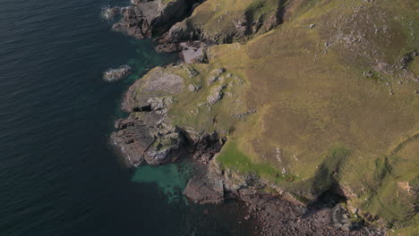 Aerial-birdseye-view-of-rocky-coast-of-Melvaig,-Scotland