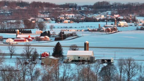 American-farms-and-farmland-covered-in-snow-during-winter-sunrise