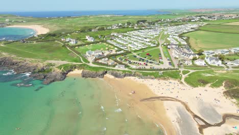 Treyarnon-Bay-in-Cornwall-from-an-Aerial-Drone-Panning-Overhead-with-Pristine-Beaches-and-Summer-Sun,-UK