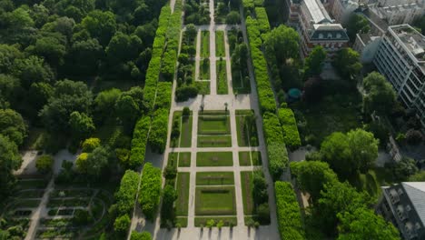 The-natural-museum-of-paris-garden-with-lush-greenery-and-pathways,-aerial-view