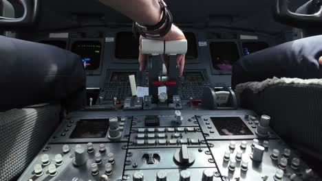 Close-up-view-of-the-flight-instruments-and-control-wheel-of-a-modern-jet-cockpit-in-a-bumpy-real-time-landing