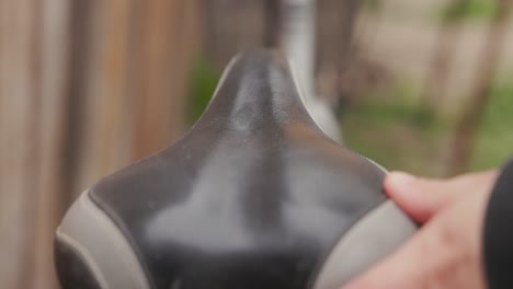 Woman-Cleaning-Bicycle-Seat---Close-Up-Shot