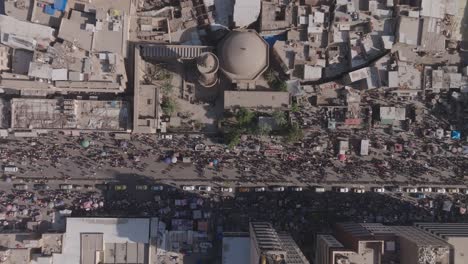 Drone-captures-bustling-Baghdad-street-market:-vibrant-stalls,-bustling-crowds,-and-colorful-goods-create-a-lively,-immersive-scene