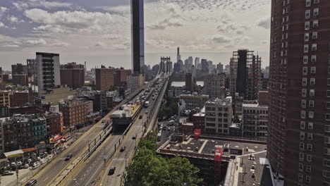 NYC-New-York-Aerial-v408-low-flyover-Chinatown-along-Manhattan-bridge-across-East-river-capturing-vehicle-traffics-and-Brooklyn-downtown-cityscape-views---Shot-with-Mavic-3-Pro-Cine---September-2023