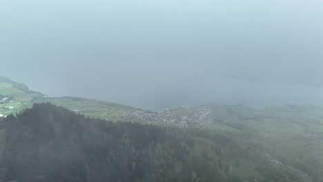 Aerial-top-down-of-weggis-town-and-lake-in-Switzerland-during-cloudy-day