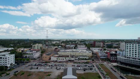 Drone-shot-flying-over-businesses-and-construction-in-downtown-Fort-Myers,-Florida