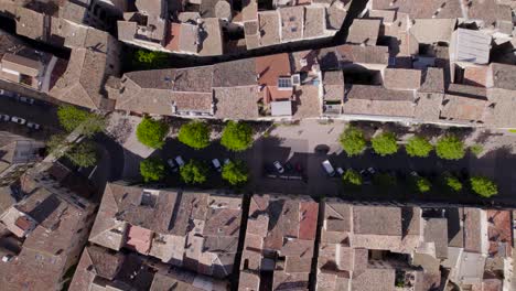 top-down-shot-overhead-cars-driving-through-the-centre-of-Pezenas