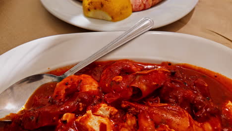 Closeup-with-shrimp-tomato-soup,-tasty-seafood-in-Athens-restaurant