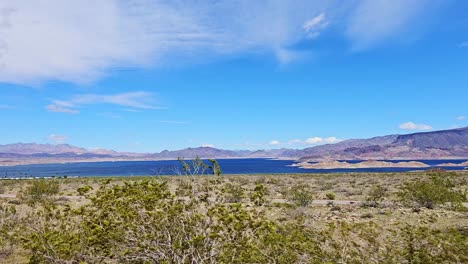 Roadside-Driveby-Along-Lake-Mead-in-Nevada-on-Route-167,-Beautiful-Blue-Skies-Over-the-Landscape,-Nevada,-USA