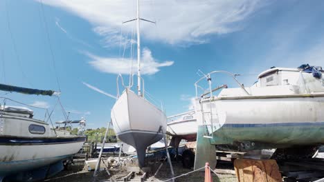 Sailing-boats-in-dry-dock-at-quiet-Southwold-marina-boatyard-River-Blyth