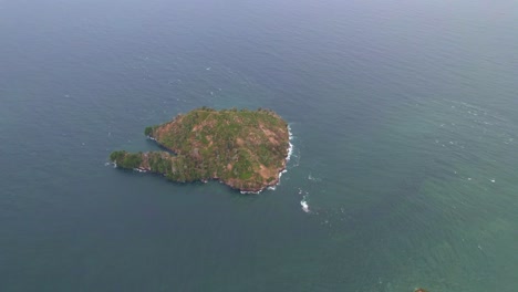 Drone-shot-of-an-islet-in-the-middle-of-an-ocean