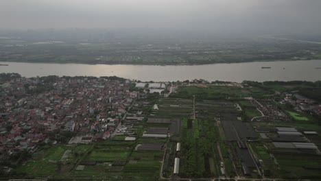 Drone-shot-of-Hanoi,-Vietnam,-with-an-aerial-view-of-the-lake