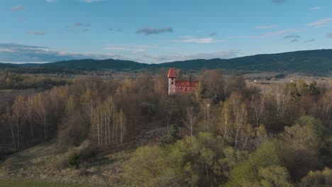 Aerial-view-of-the-romanesque-church-of-saint-Mikuláš-in-Boletice-in-Czechia