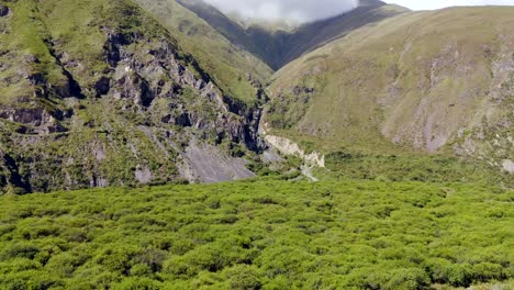 Drone-rapidly-approaching-a-magnificent-waterfall-in-the-Andes-Mountains-near-Jujuy,-Argentina