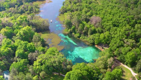 Aerial-shot-slowly-flying-over-Rainbow-Springs-State-Park-and-river-below