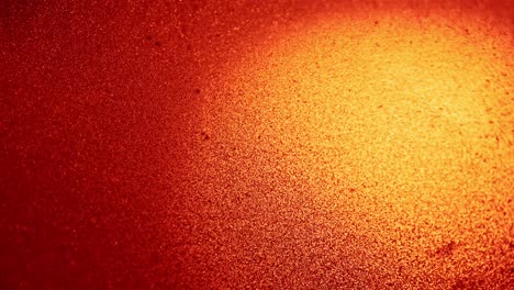 Experimentalvideo-Von-Roten-Partikeln-Vor-Orangefarbenem-Hintergrund