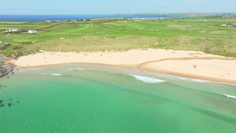 Constantine-Bay-with-Turquoise-Waters-Along-the-Cornish-Beach-Coastline-with-Scenic-Landscape-from-an-Aerial-Drone-in-the-UK