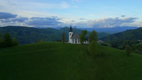 Blue-sky-background,-aerial-dolly,-isolated-small-religious-building