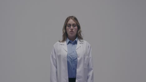 Female-doctor-in-white-coat-and-wearing-glasses-of-caucasian-race-on-white-background