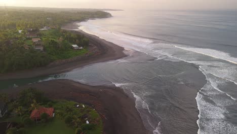 Balian-surfers-beach-with-blue-green-waves-swelling-along-the-shoreline