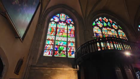 Stained-glass-windows-interior-and-vaulted-ceiling-of-Saint-Julian-Gothic-Cathedral,-Le-Mans-in-France