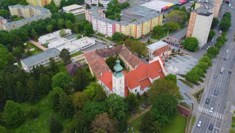 City-view-of-Szombathely,-Hungary,-Drone-flies-above-the-city-captures-busy-road,-city-view-and-its-architecture-buildings