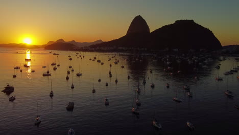 The-sun-rises-over-the-Botafogo-Cove-and-Sugar-Loaf-mountain-in-Rio-de-Janeiro-city,-Brazil