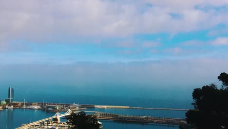 beautiful-calm-day-at-the-international-shipping-port-of-Barcelona-blue-skies-and-water