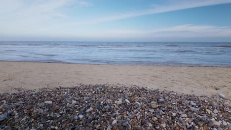 Deserted-Sea-sand-and-sky-with-pebble-beach-Southwold,Suffolk-UK