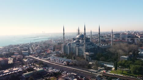 Iconic-Blue-Mosque-in-Istanbul,-Turkey,-with-its-majestic-domes,-minarets,-surrounded-by-the-cityscape-and-historic-landmarks