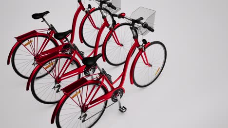 Three-red-3D-bicycles-on-white-background,-3D-animation,-camera-zoom-out-slowly