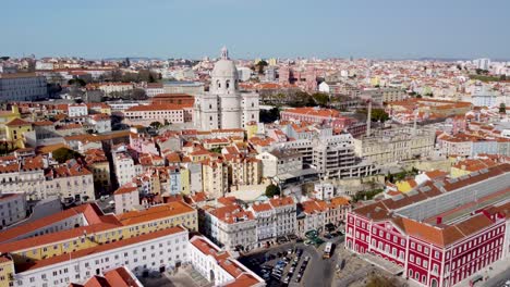 Pantheon-to-street-level-at-Igreja-de-Santa-Engrácia-in-Lisbon,-Portugal,-showcasing-the-city's-historic-landmarks-and-colourful-architectural-beauty