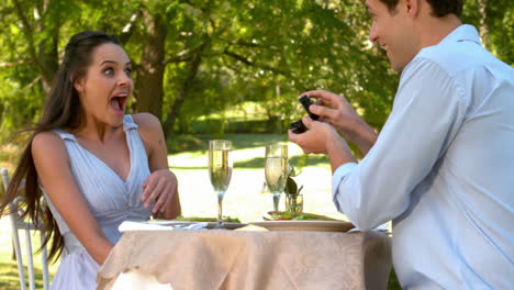 Man-proposing-marriage-to-his-shocked-girlfriend-