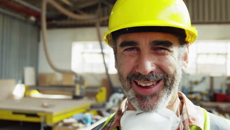 Portrait-of-attractive-carpenter-smiling-for-camera