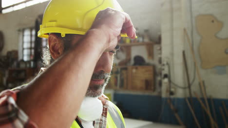 Carpenter-wearing-hard-hat-