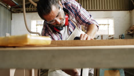 Focus-on-carpenter-working-with-wood-