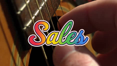 Animation-of-sales-text-over-hand-playing-guitar