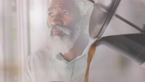 Animation-Von-Kaffee-über-Einem-Afroamerikanischen-Mann,-Der-Einen-Becher-Hält-Und-Trinkt,-Zeitlupe