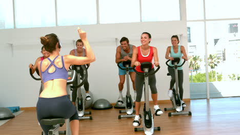 Spin-class-working-out-with-instructor