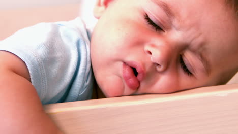 Baby-boy-lying-in-crib